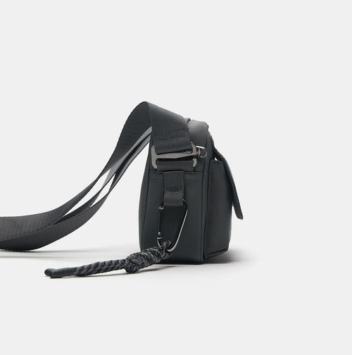 Charcoal Grey Black Compact Flap Bag with Braided Charm Detail and Adjustable Strap