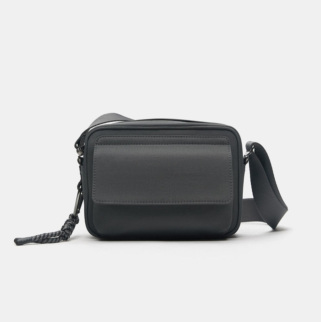 Charcoal Grey Black Compact Flap Bag with Braided Charm Detail and Adjustable Strap